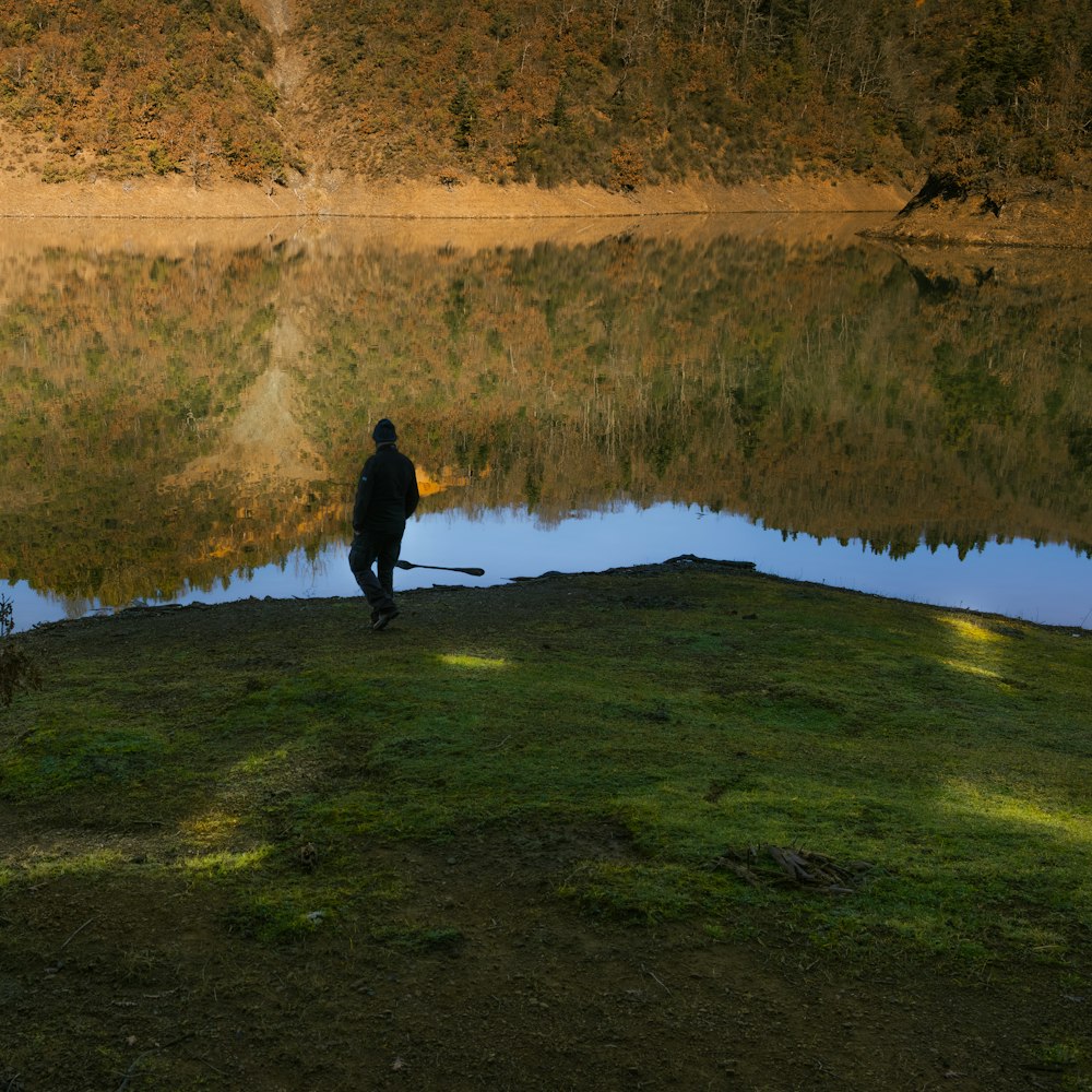 a person standing near a body of water