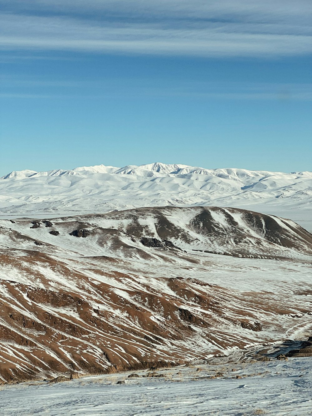 a man riding skis on top of a snow covered slope