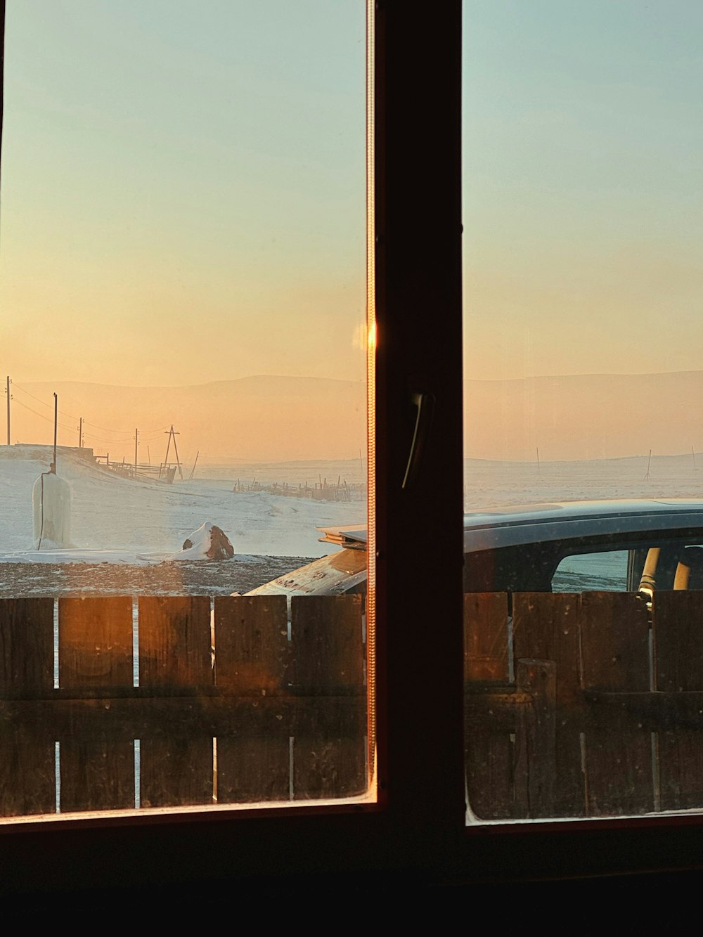 a window view of the ocean and a car