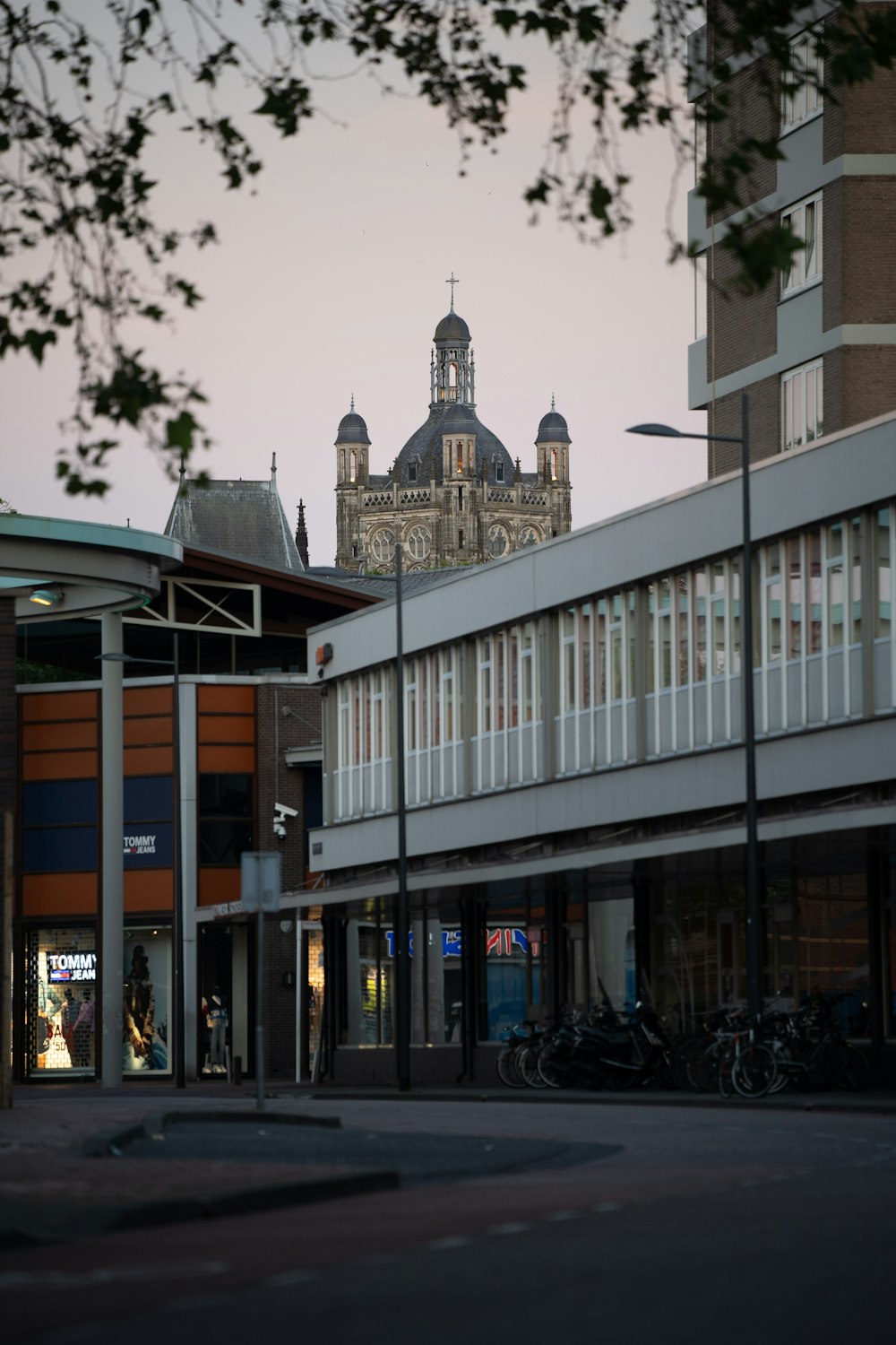 a tall building with a clock tower in the background