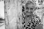 a black and white photo of an older woman