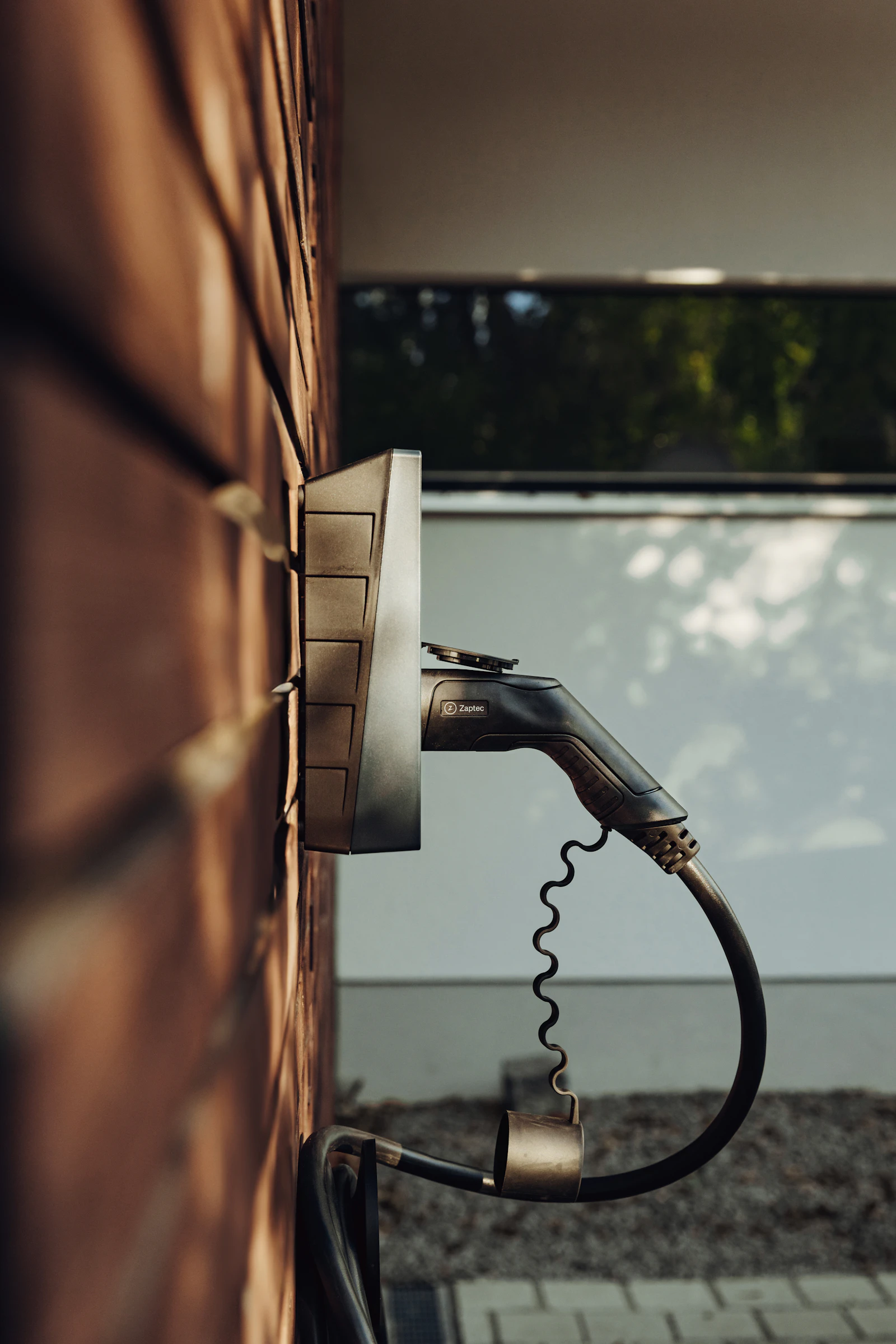 A home EV charging unit mounted on an exterior wall