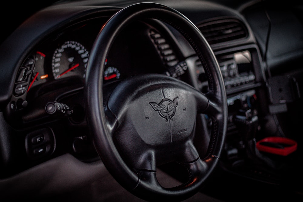 a steering wheel and dashboard of a car