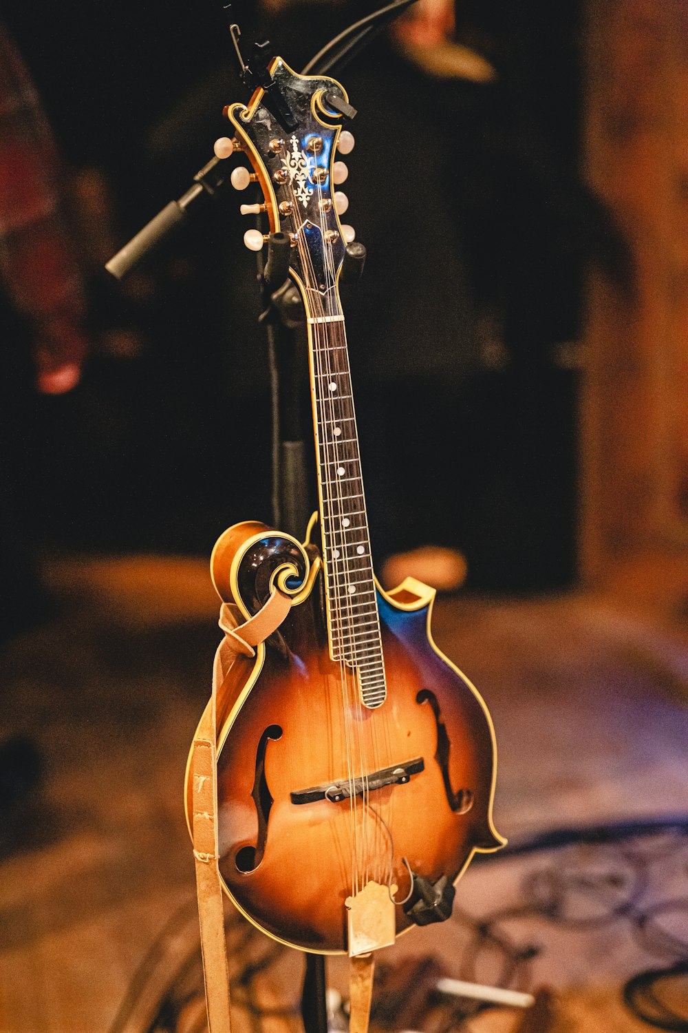 a mandolin sits on a stand on a table