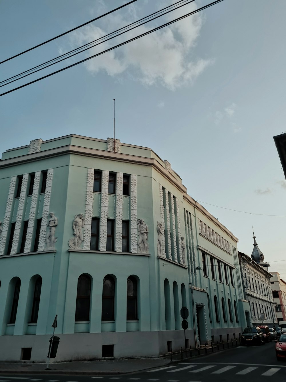 a large blue building sitting on the side of a road