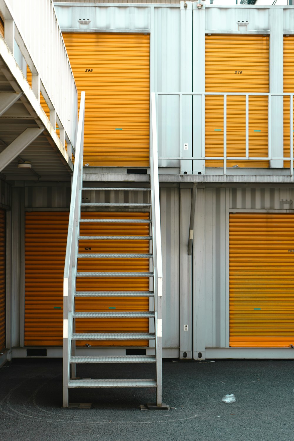 a set of stairs leading up to a storage unit