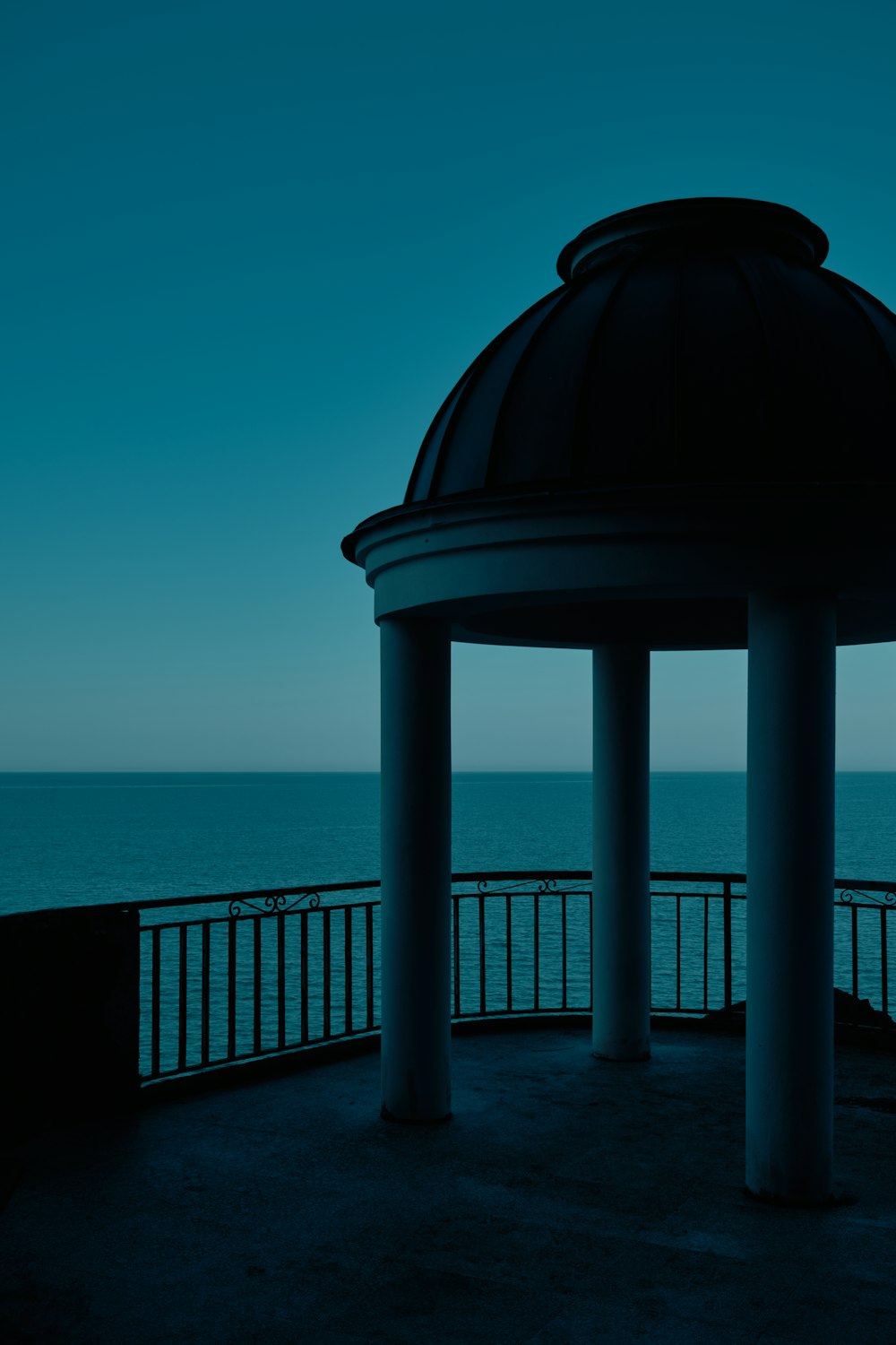 a view of the ocean from a gazebo