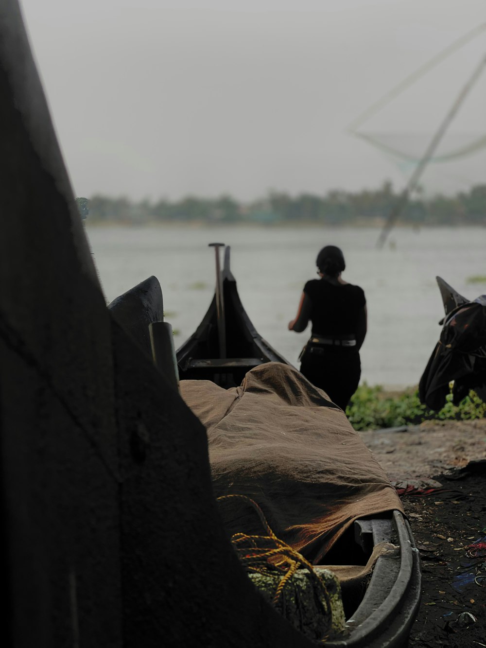 a couple of boats sitting on top of a river