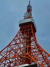 a very tall tower with a clock on it's side