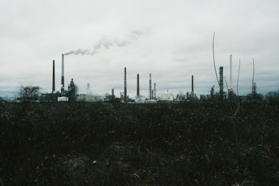 a factory with smoke coming out of it's stacks