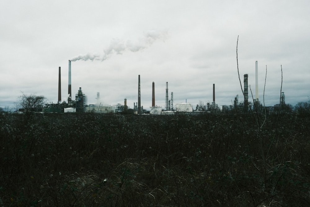 a factory with smoke coming out of it's stacks