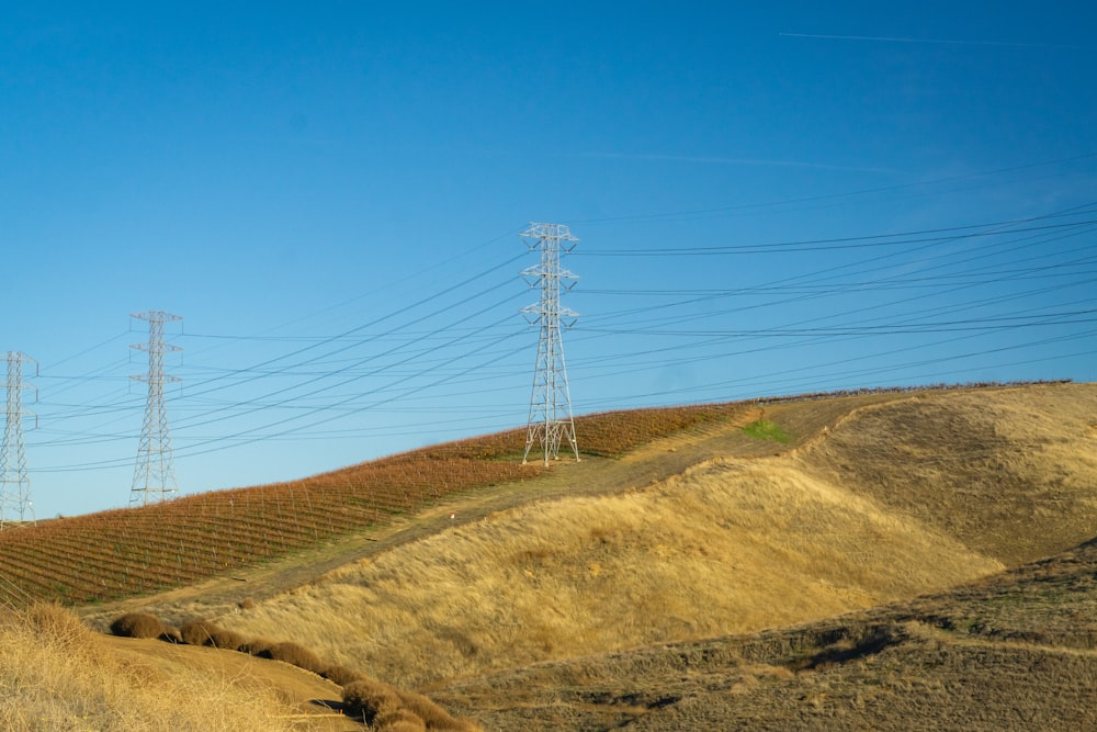 a hill with power lines in the distance