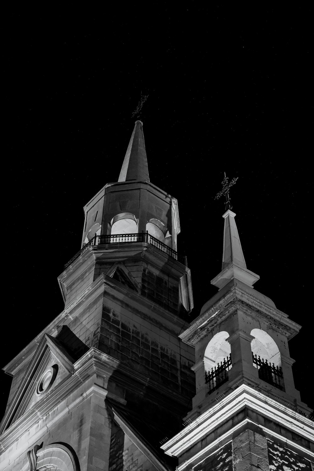 a black and white photo of a clock tower