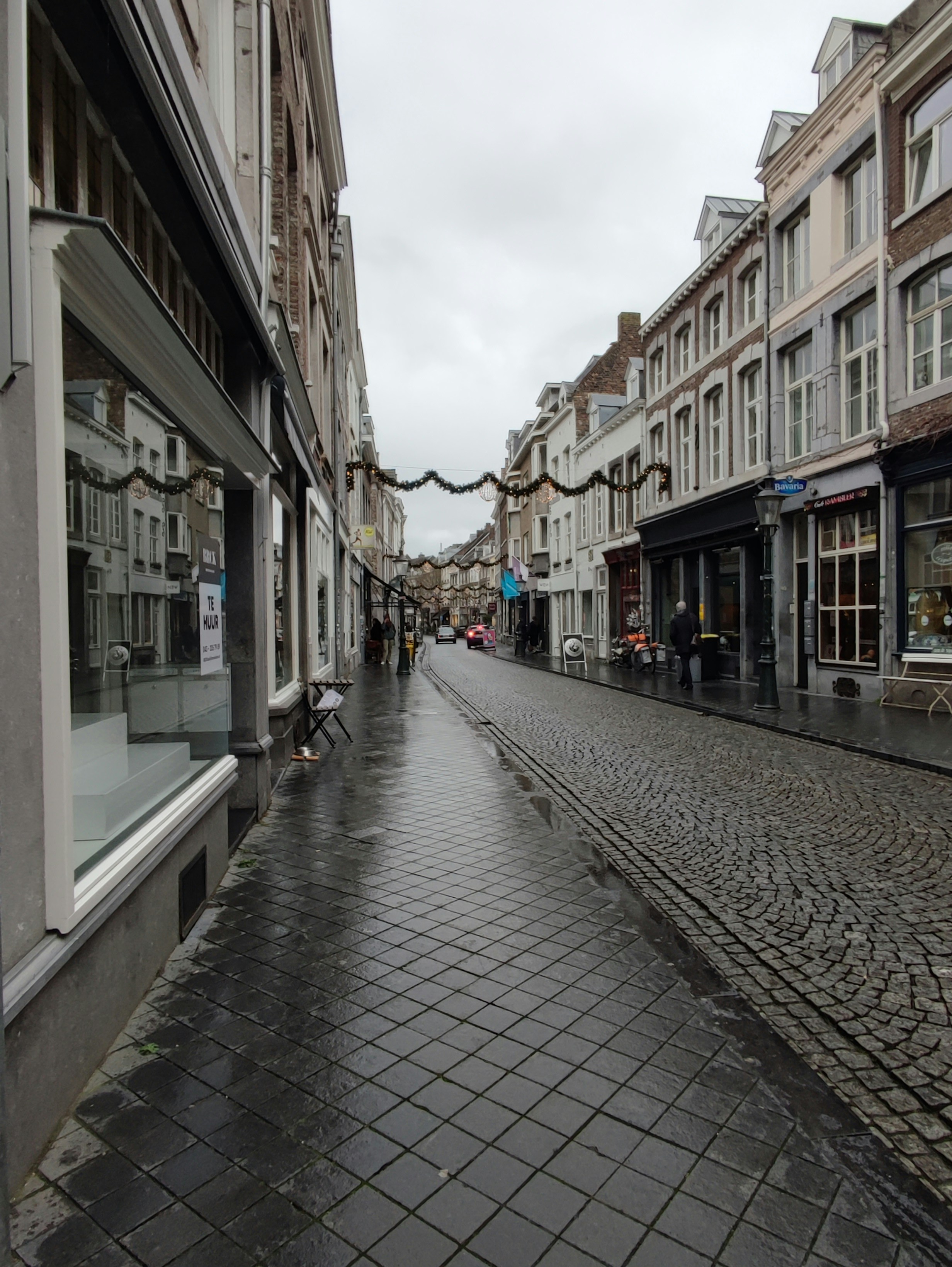 a cobblestone street in a european city