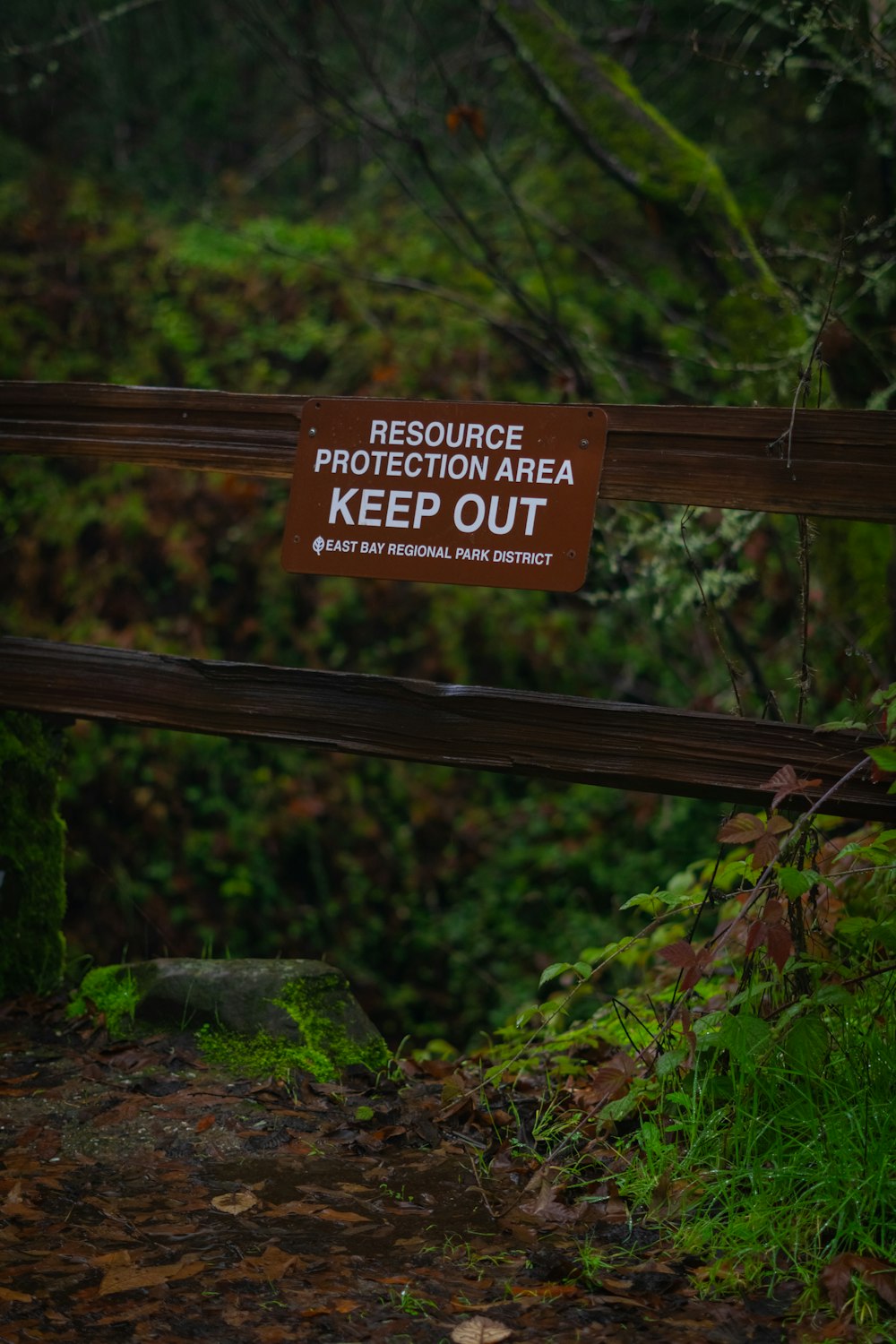 a sign that is on a wooden fence