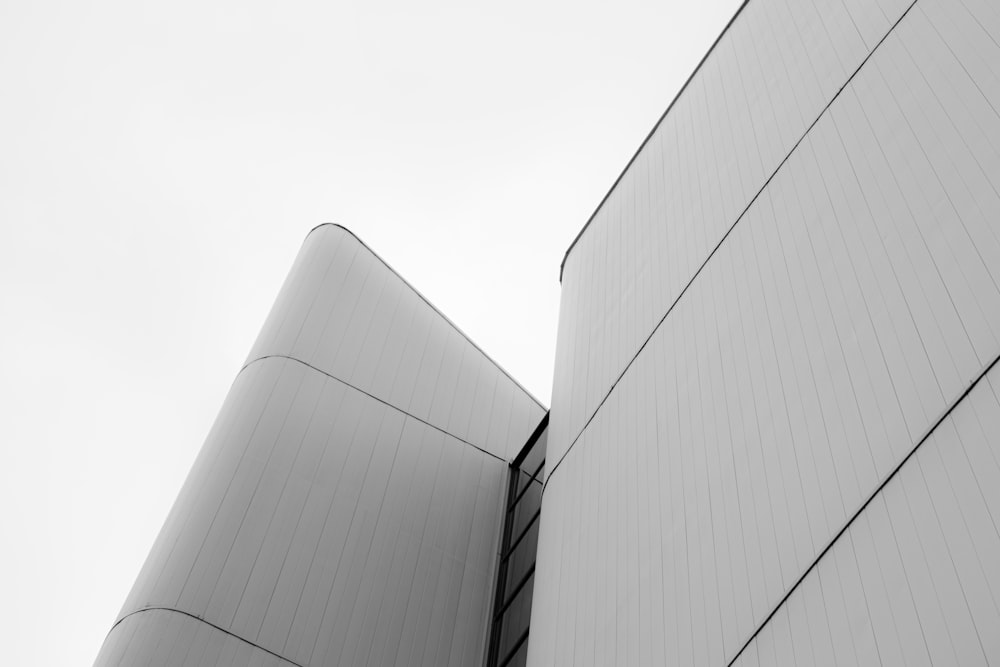 a black and white photo of two tall buildings