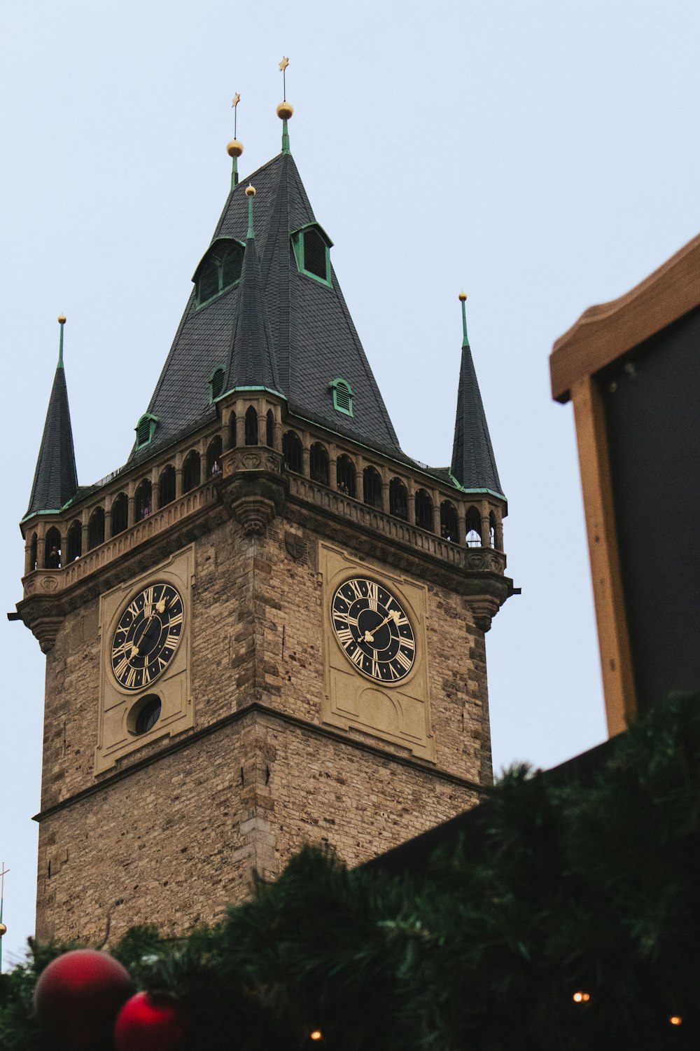 a tall clock tower with a clock on each of it's sides