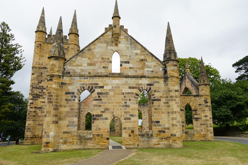 an old stone church with a walkway leading up to it