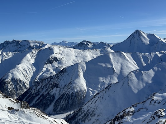 Snow-covered Silvretta peaks under a deep blue sky