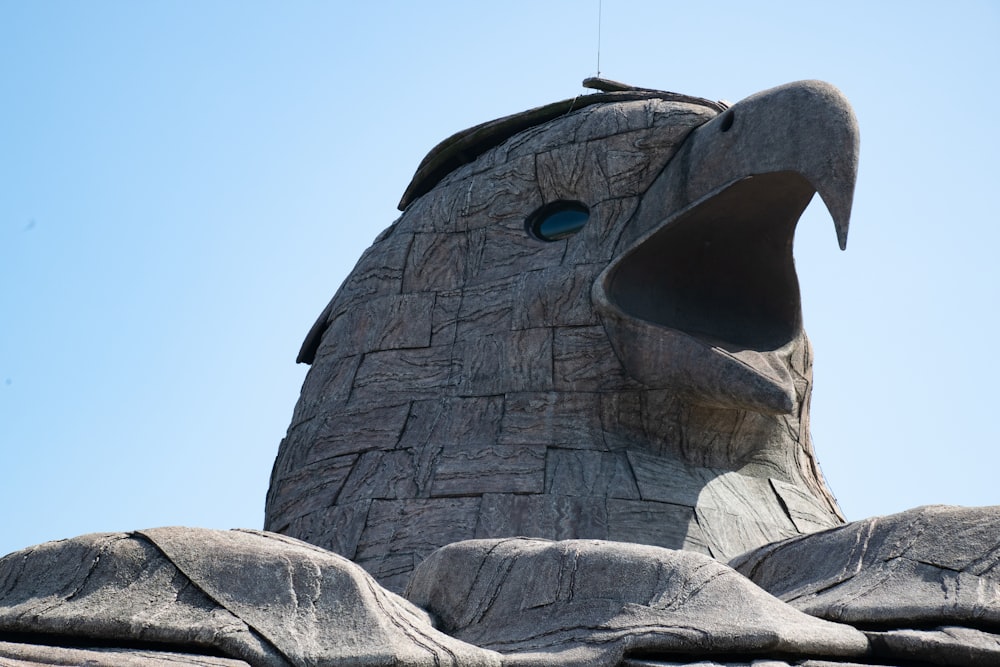 a statue of a bird with its mouth open