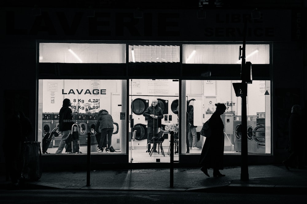 a black and white photo of a store front