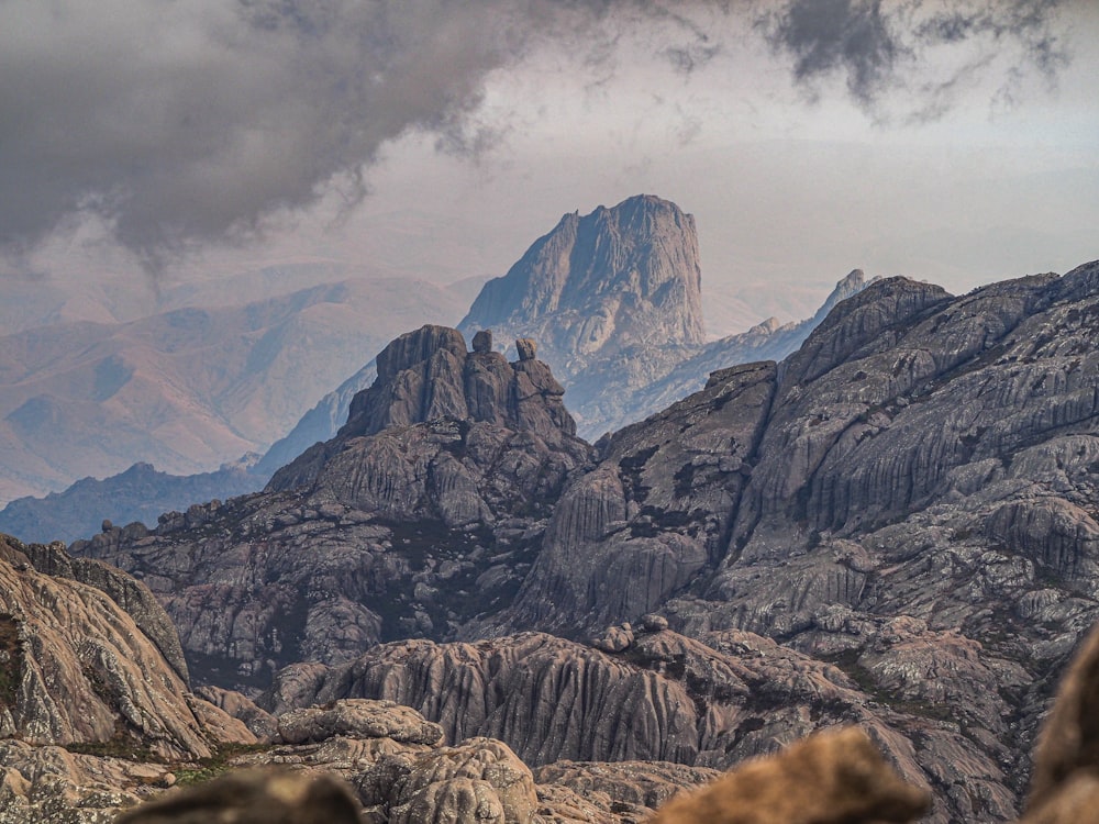 a mountain range with rocks and mountains in the background