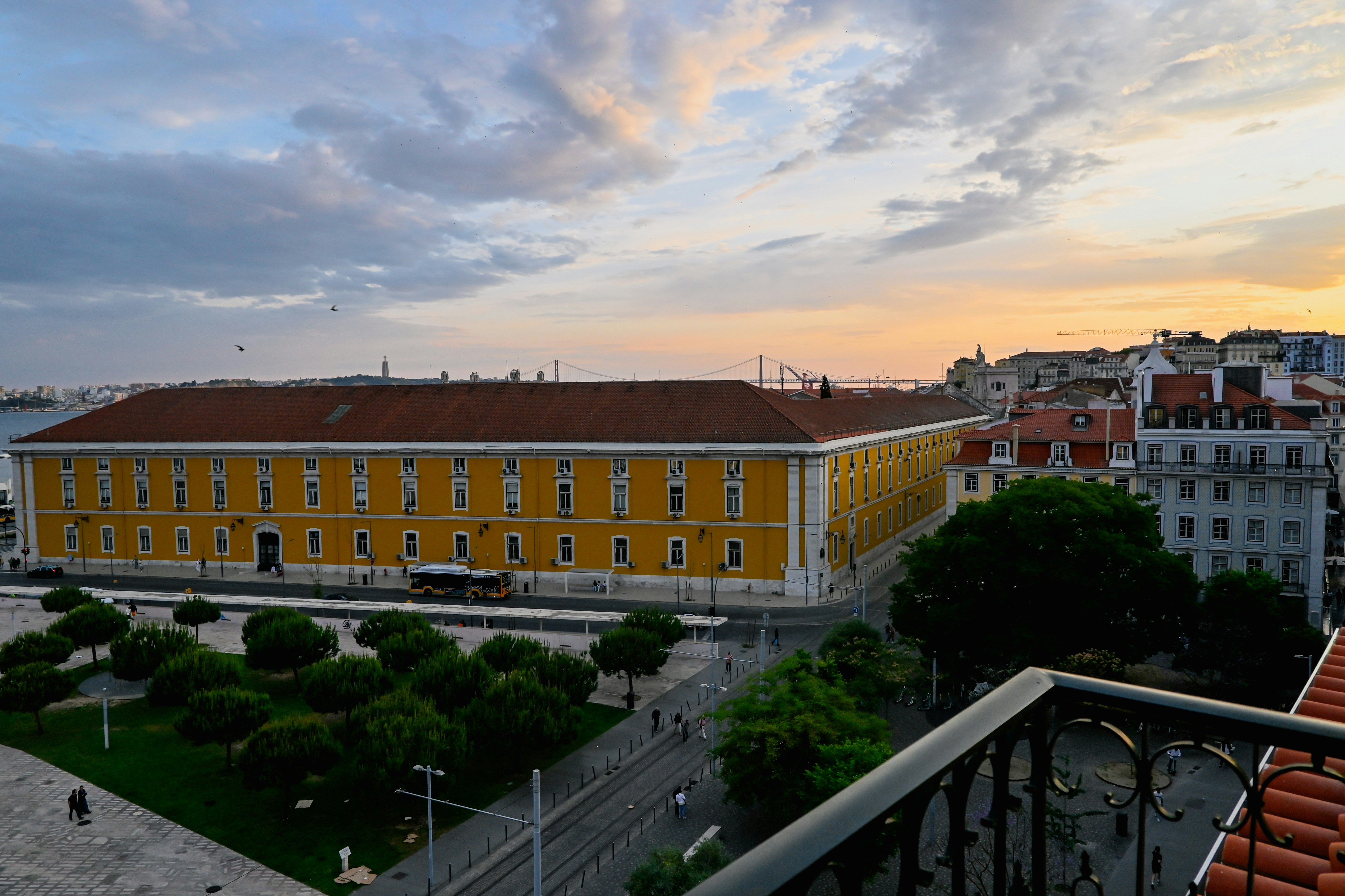 a view of a yellow building from a balcony