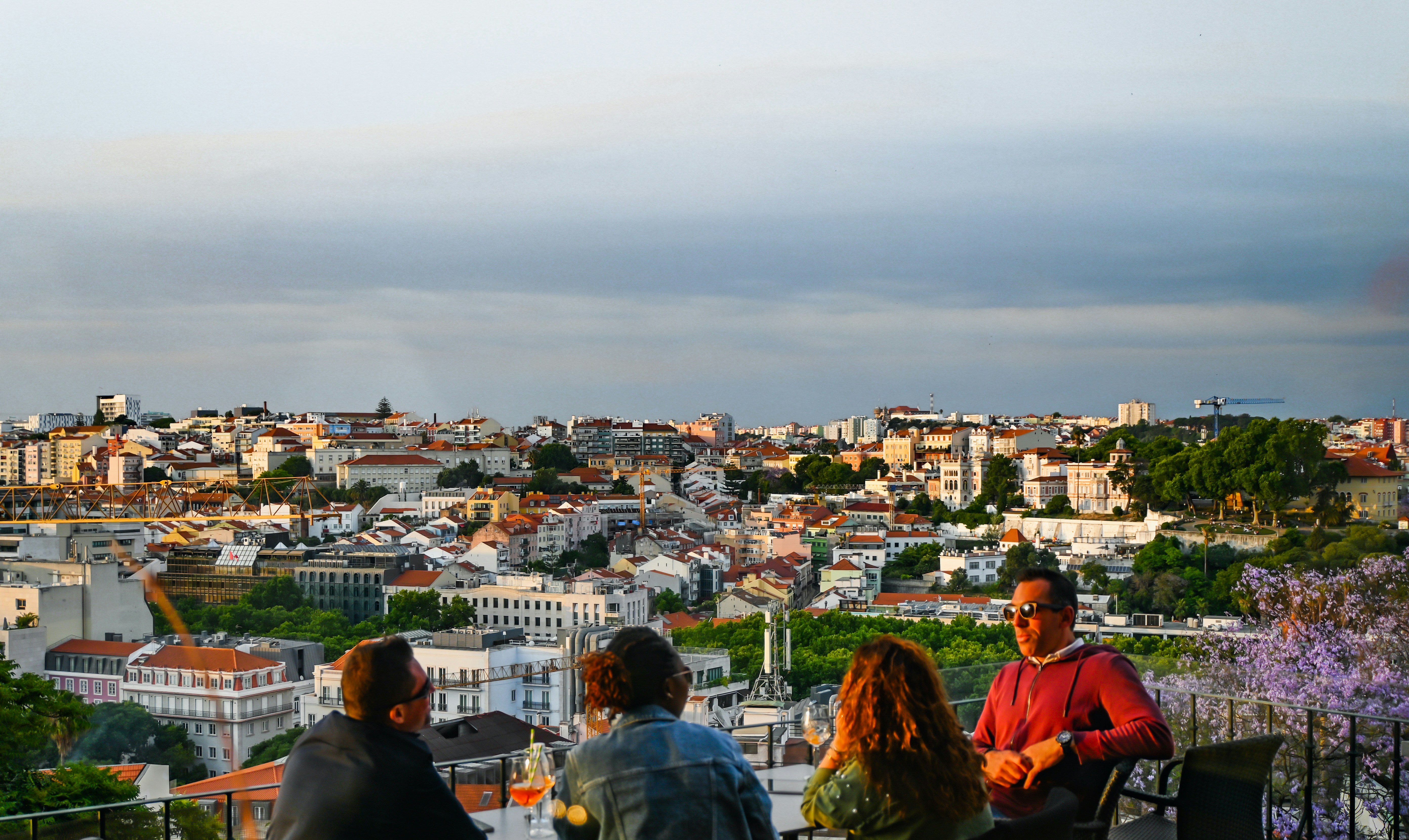 rooftop sunset social gathering with city skyline views - best apartment community amenities