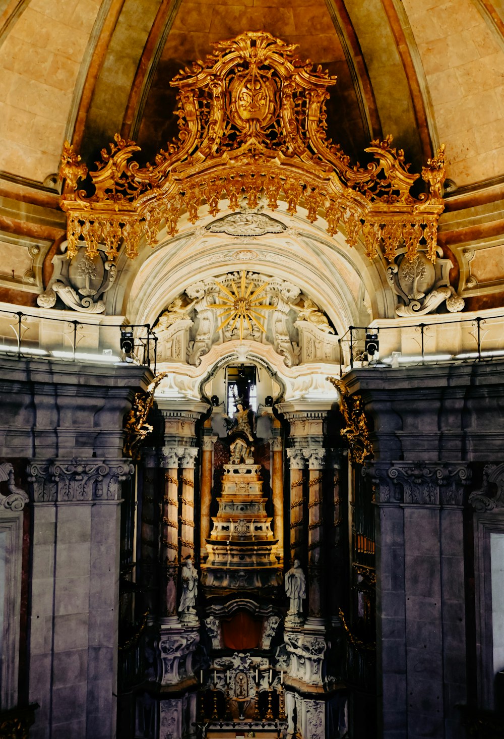 a church with a large gold alter in the middle of it