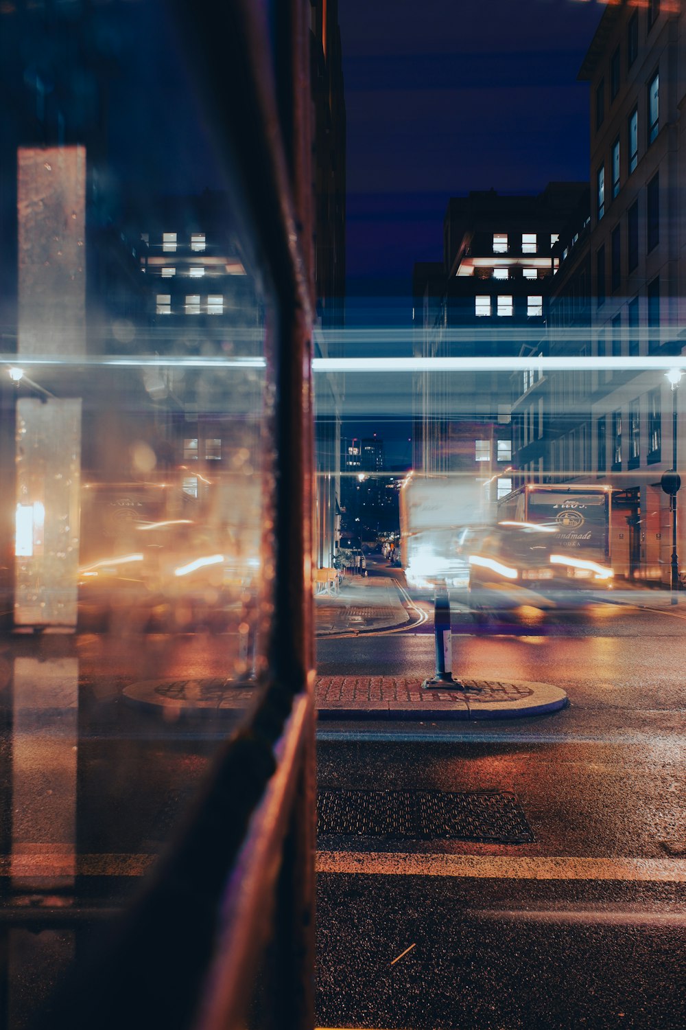 a blurry photo of a city street at night