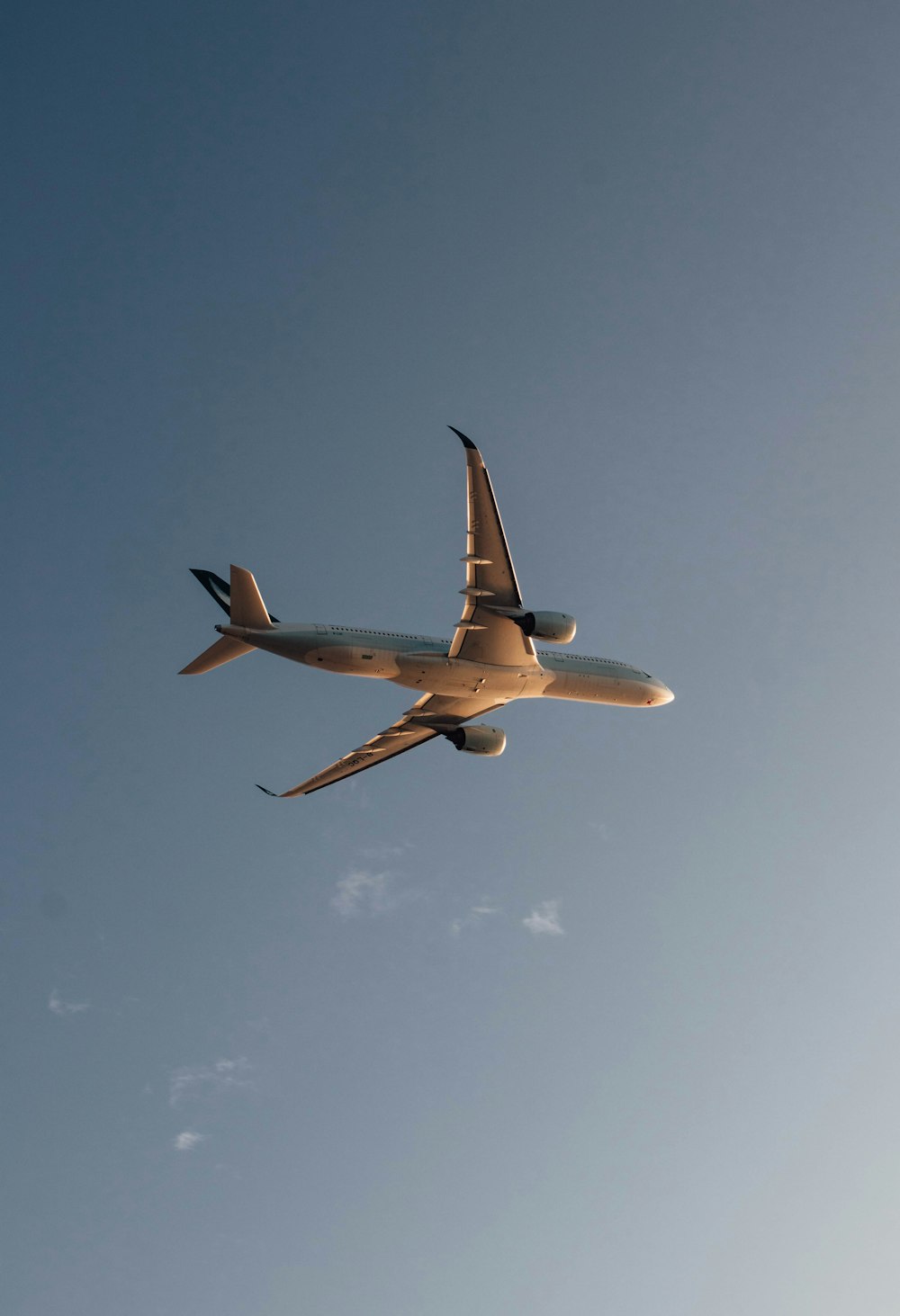 a large jetliner flying through a blue sky