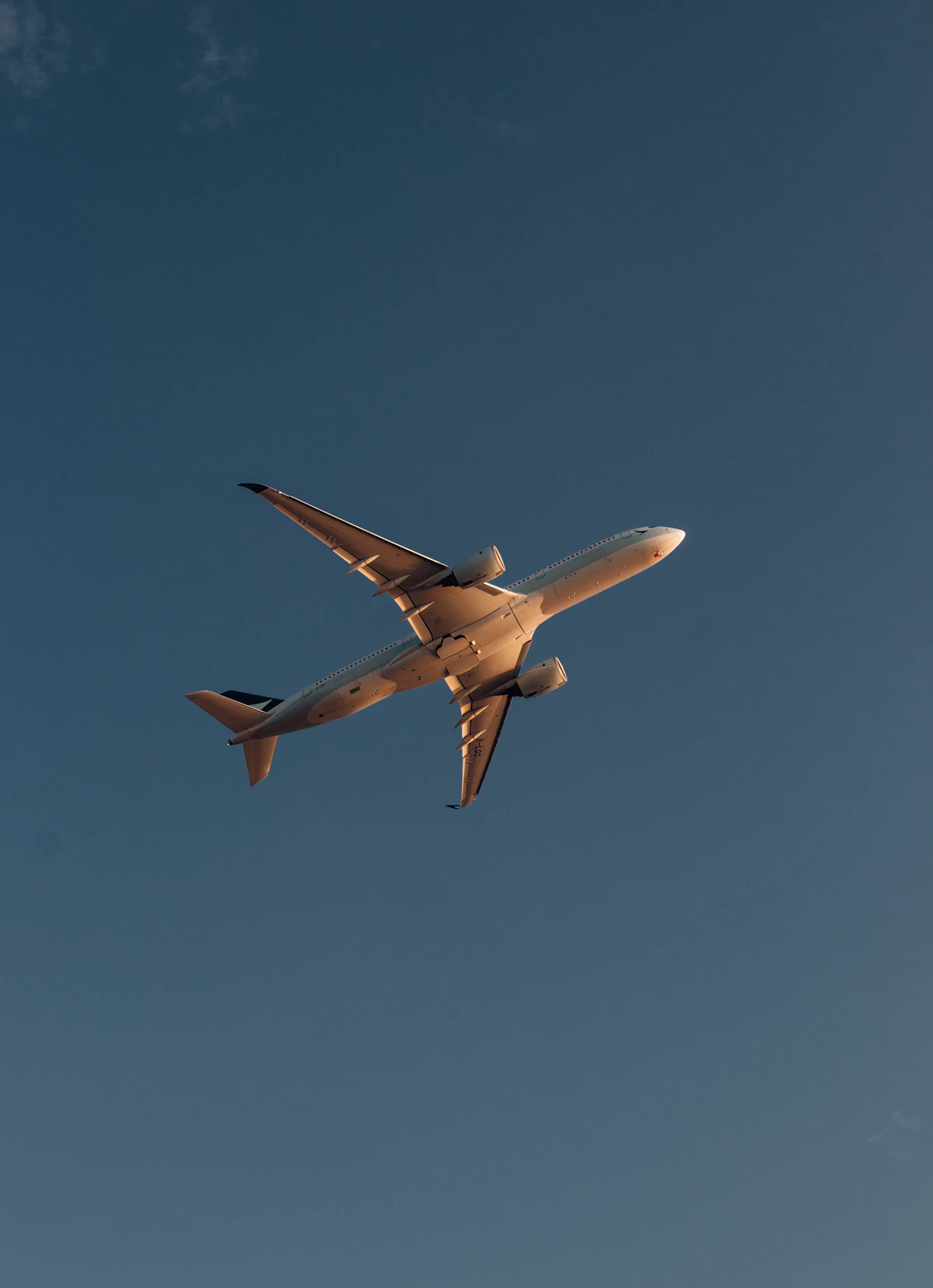 Full aircraft flying across a blue sky