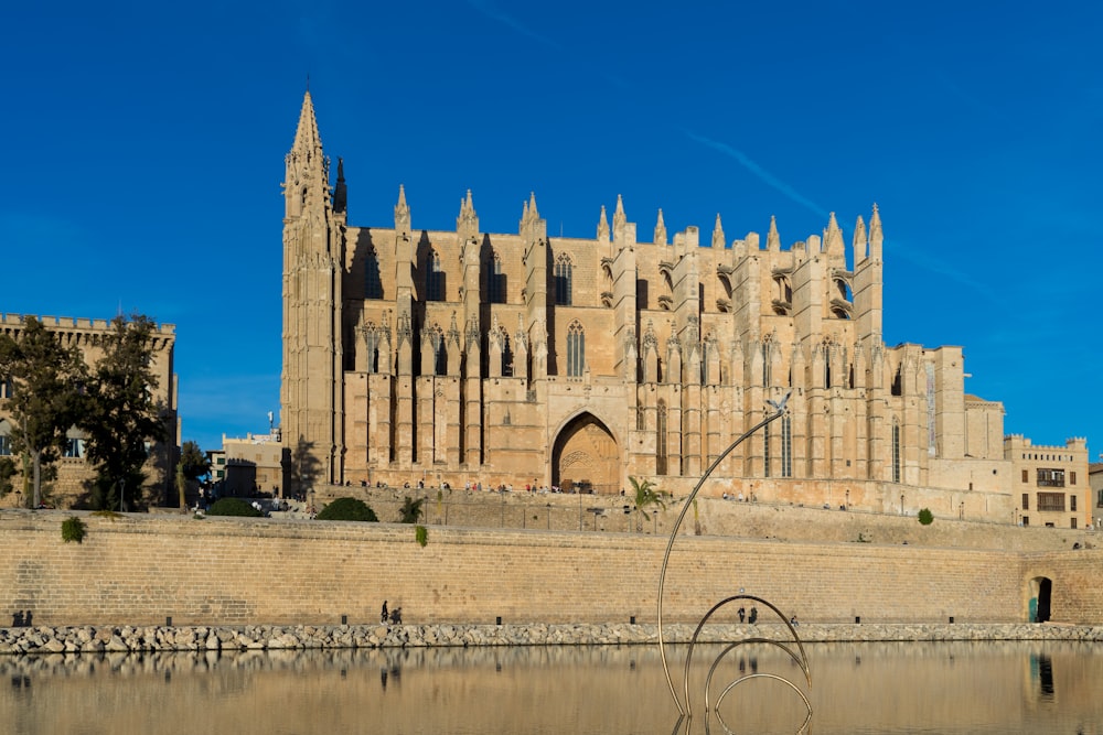 a large building sitting next to a body of water