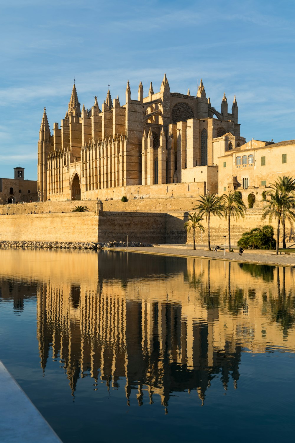 a large building sitting next to a body of water