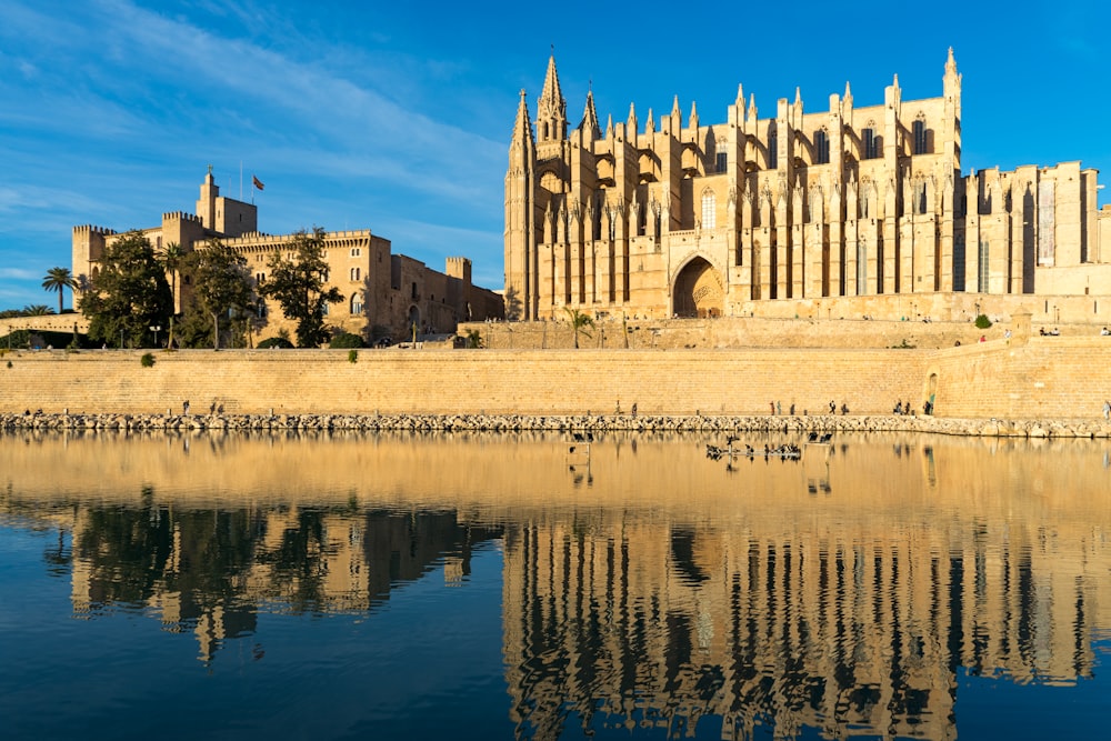 a large building sitting next to a body of water