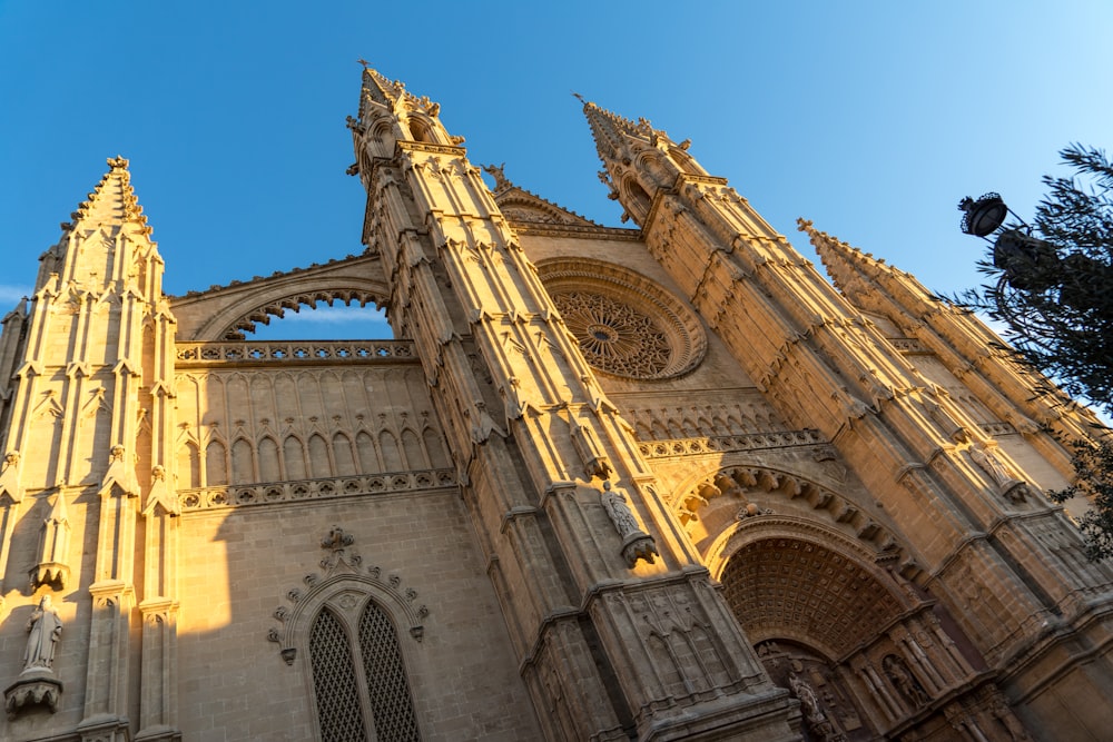 a very tall cathedral with a clock on it's side