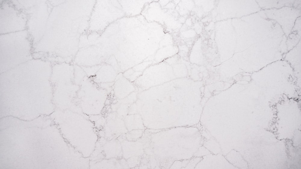 a close up of a white marble surface