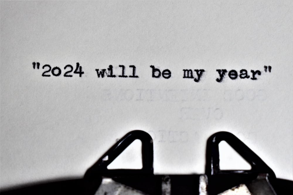 a close up of a typewriter with a paper that says, 2012 will be