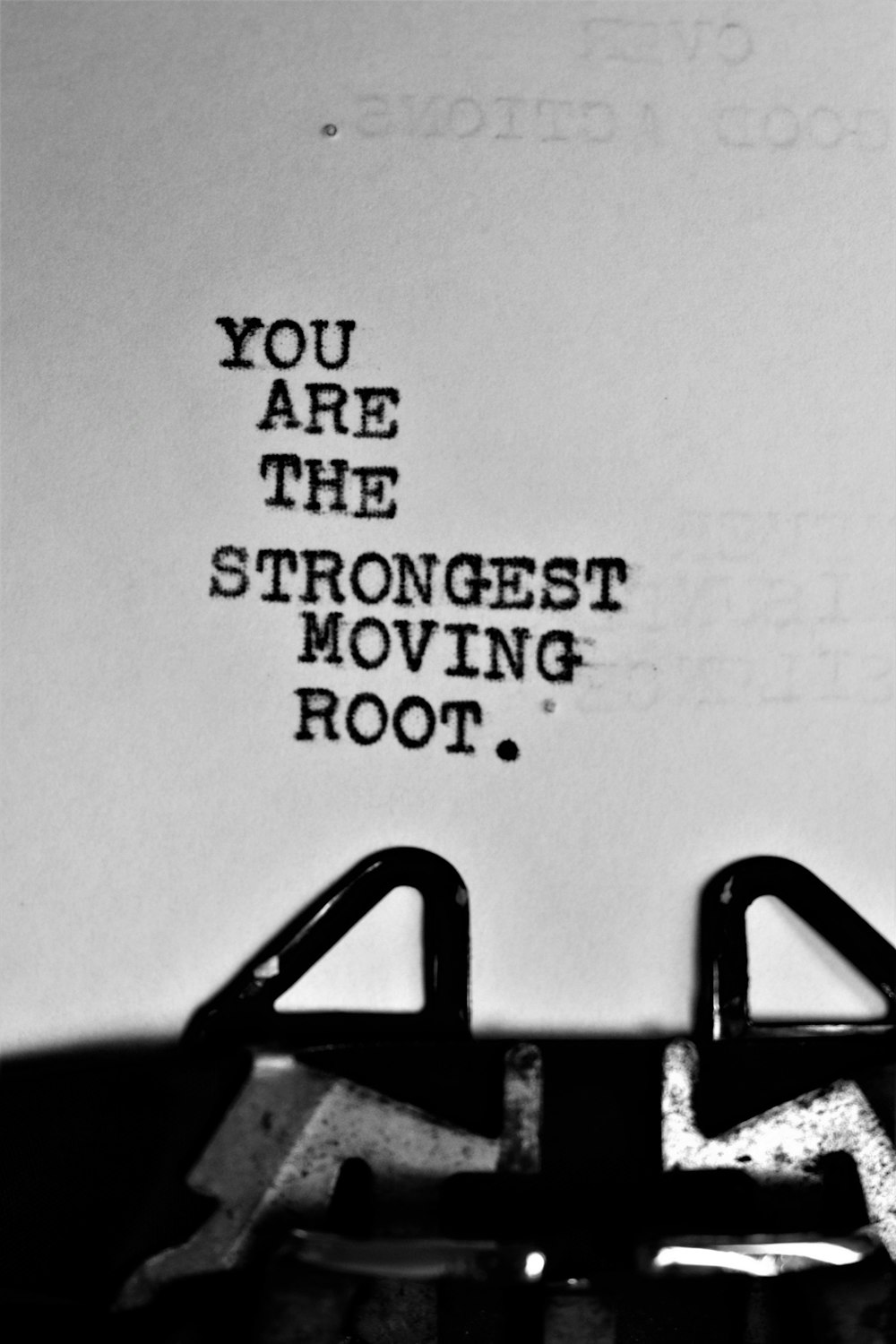a typewriter with the words you are the strongest moving root