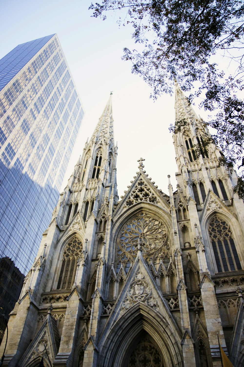 a large cathedral with a very tall building in the background