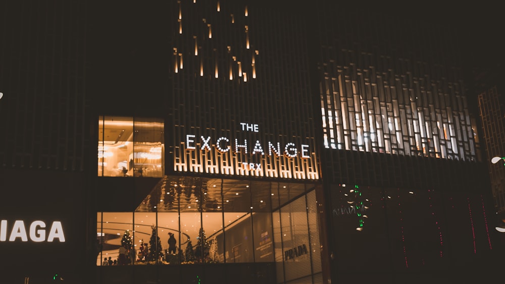 a large building with a lit up entrance