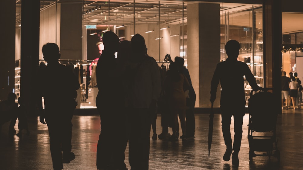 a group of people standing in front of a building