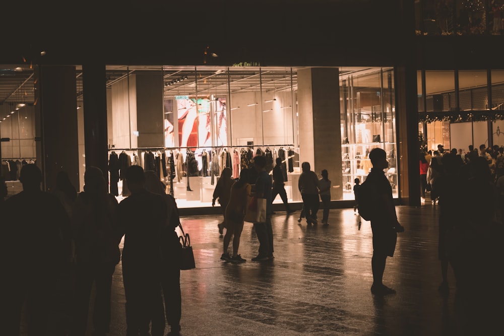 a group of people standing in front of a building