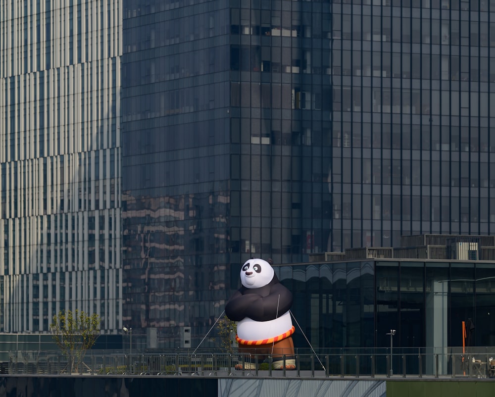 a giant panda balloon floating in the air