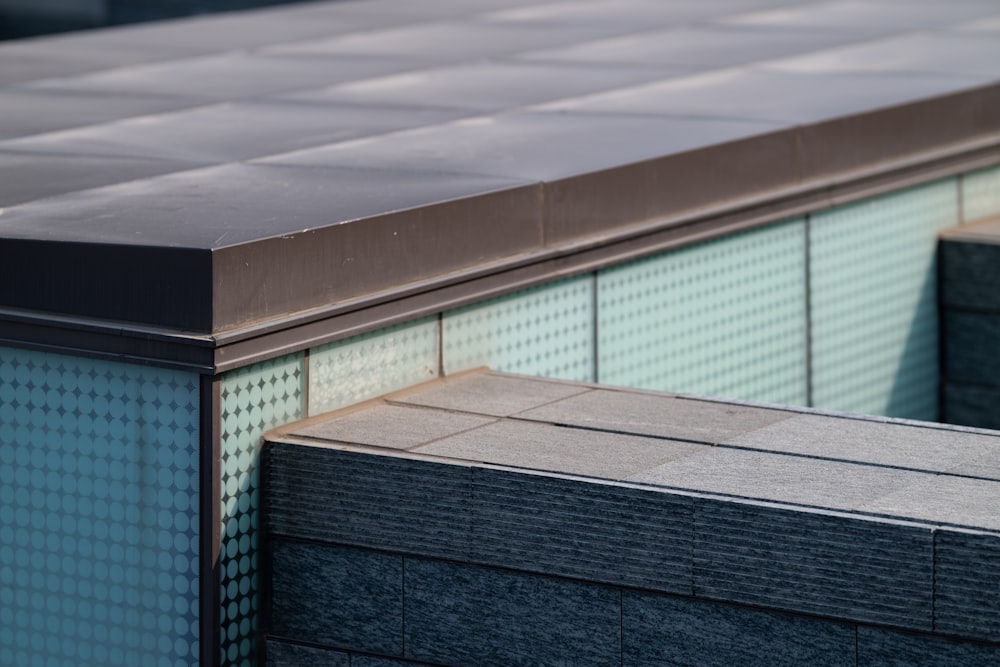 a close up of a metal roof on a building