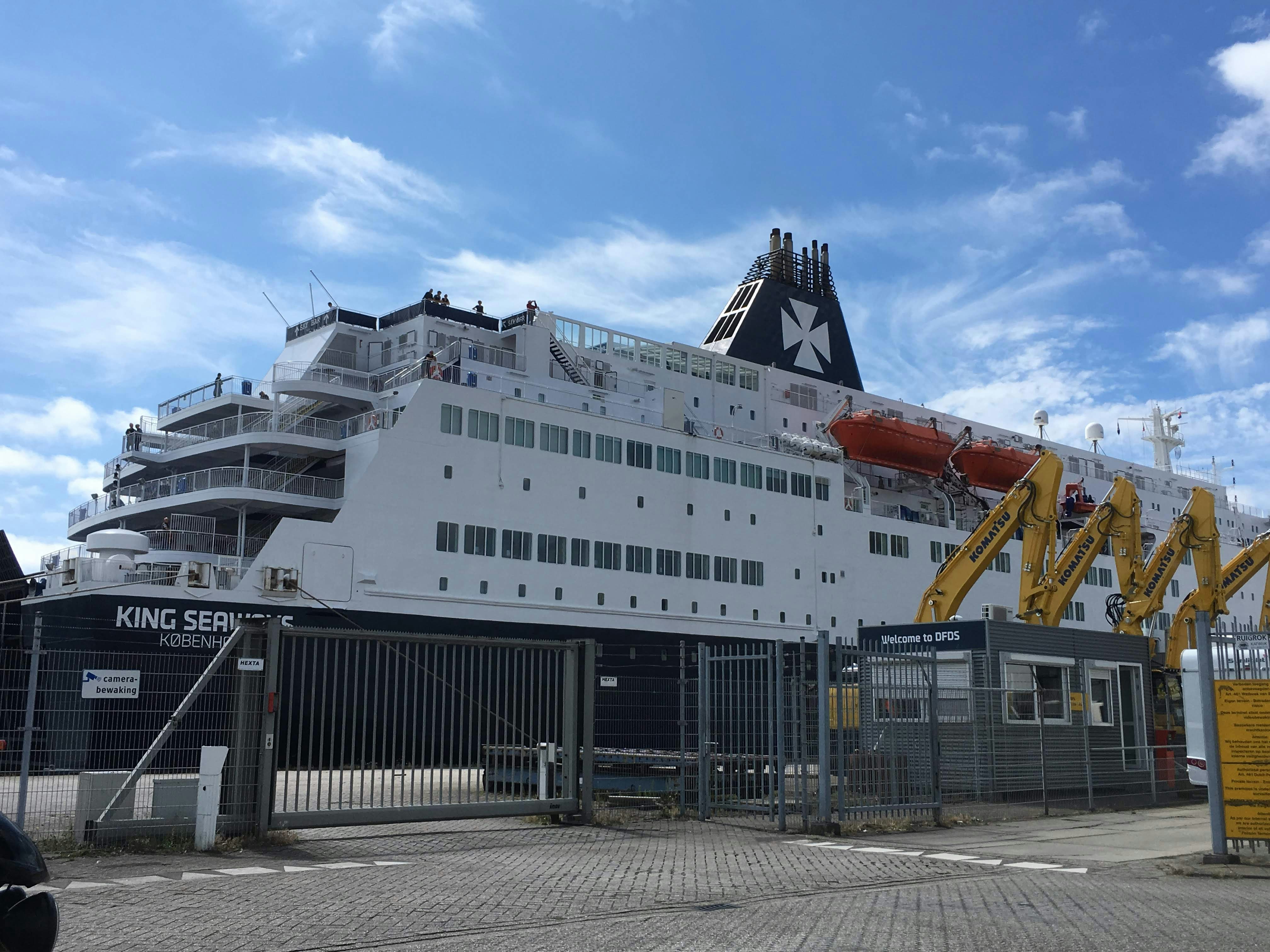 a large cruise ship docked at a dock