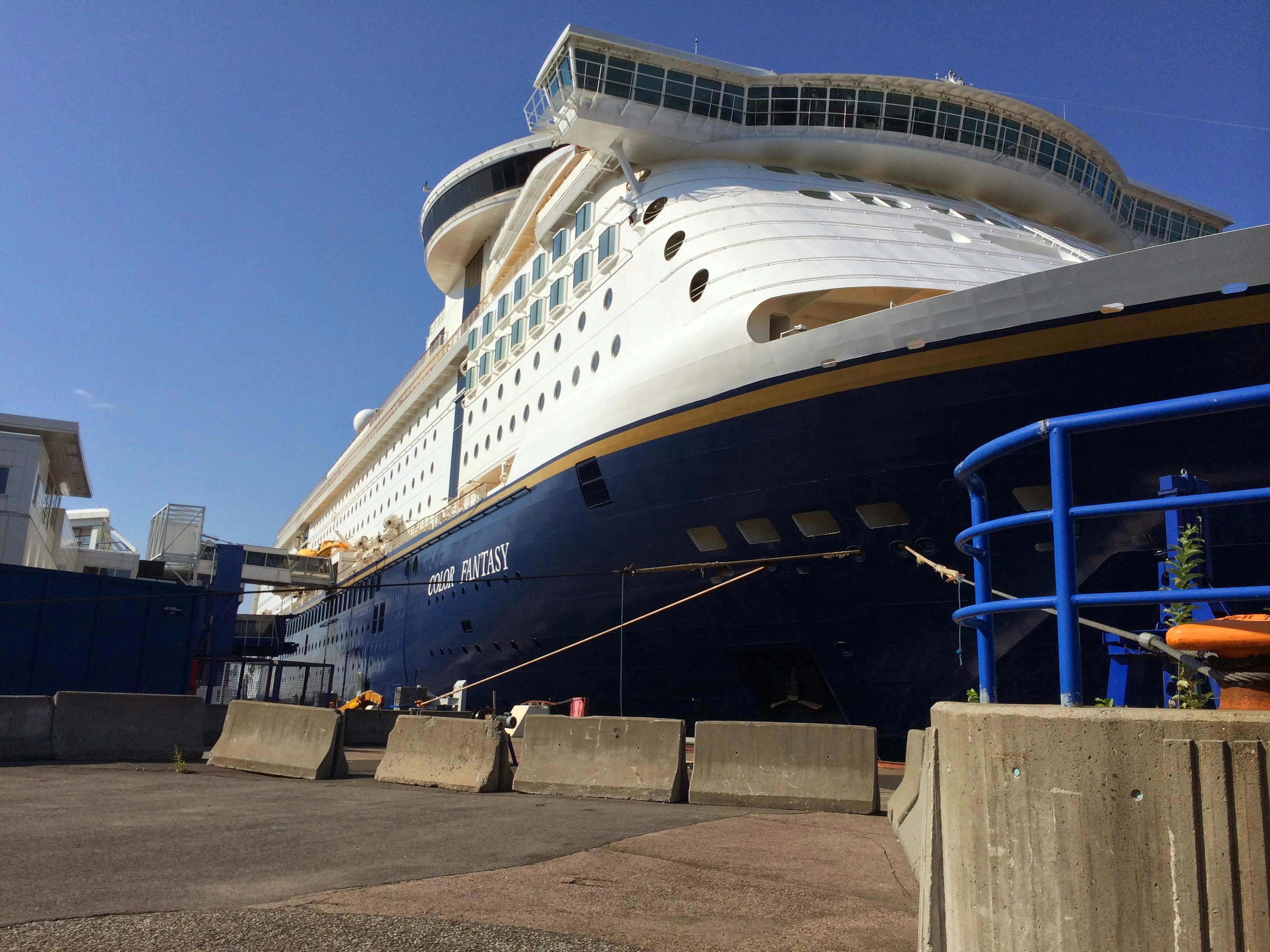 a large cruise ship docked at a dock