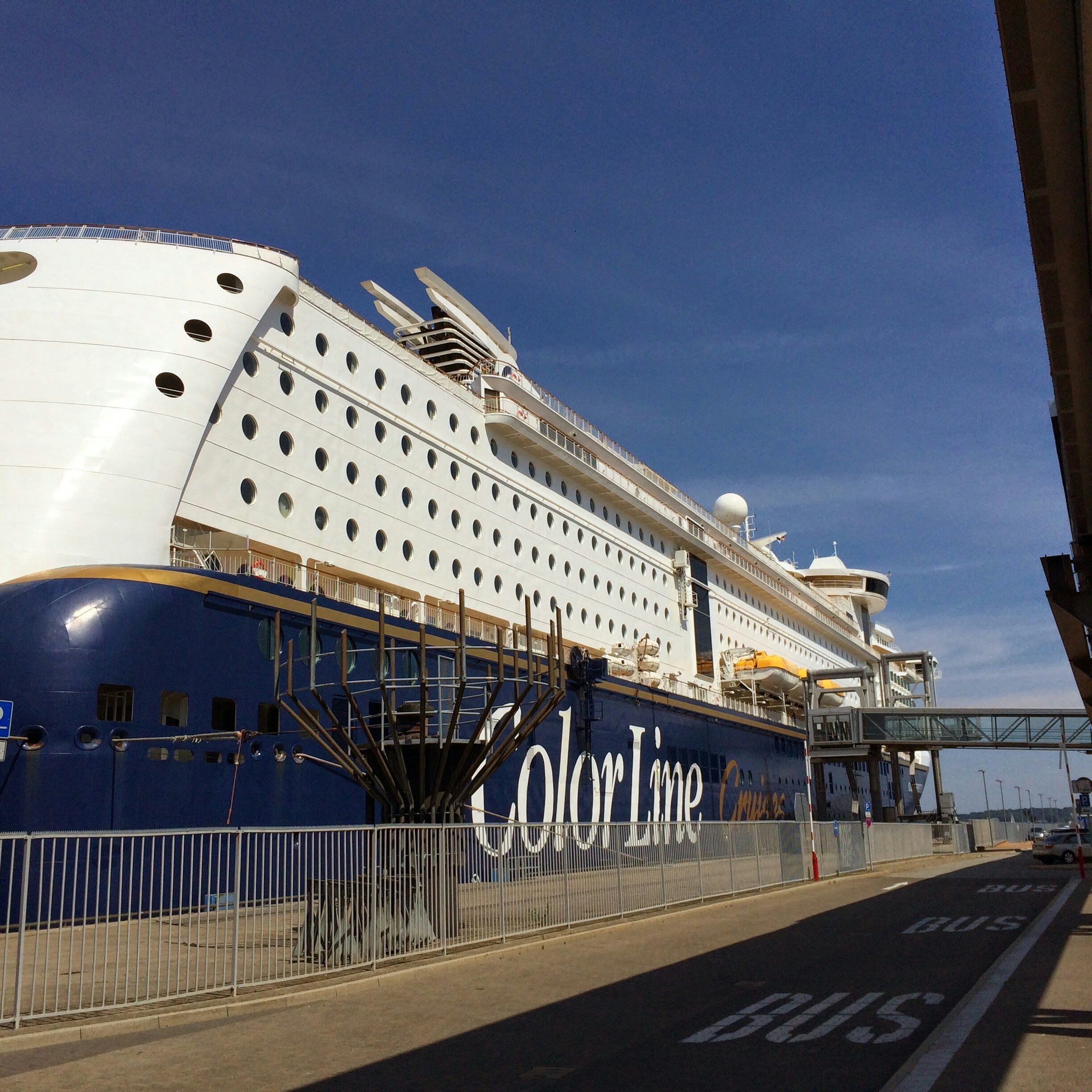 a large cruise ship docked at a dock