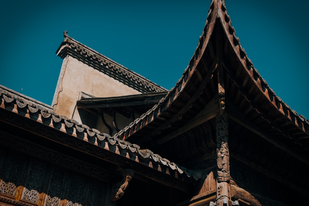 the roof of a building with a blue sky in the background