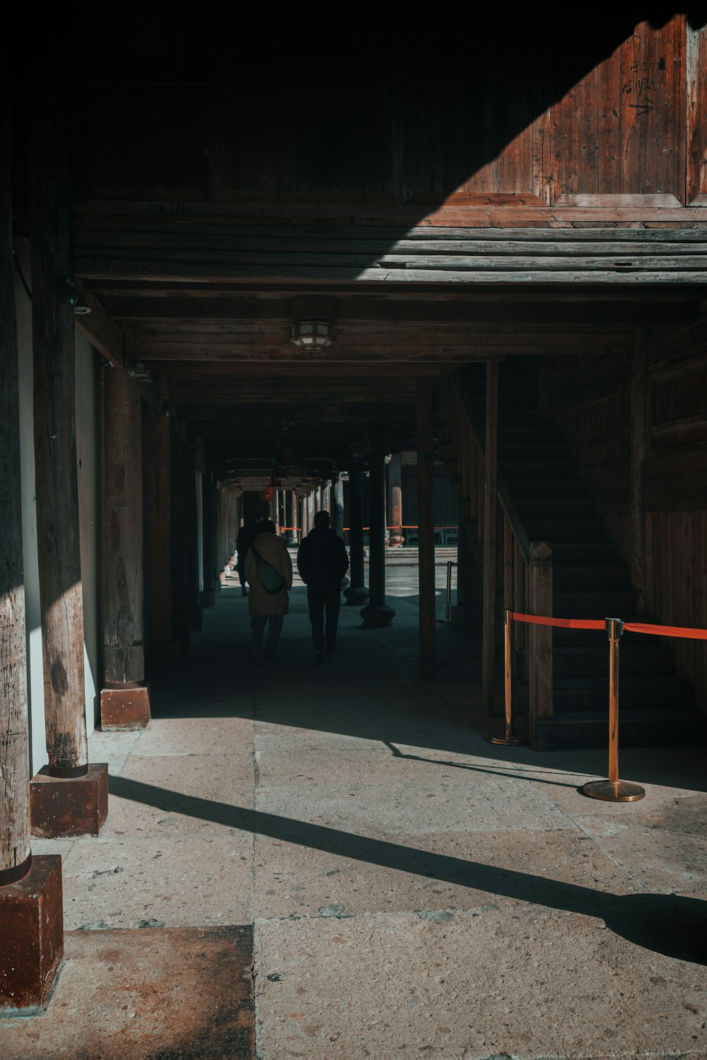 a group of people walking down a walkway